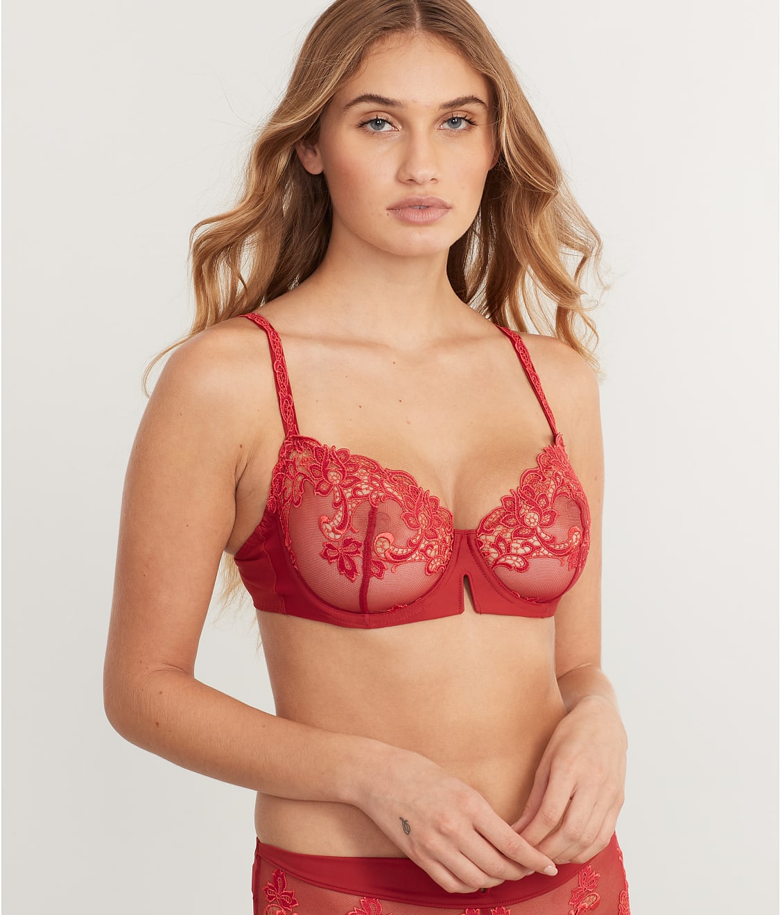 contrasting large old fashioned type bra with small sexy bra Stock